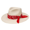 Beige hat with a red bandana on a white background