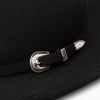 Black hat with a decorative belt and buckle on a dark background