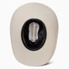 White cowboy hat with black interior on a white background