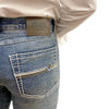 Close-up of blue jeans with a visible 'Starr' brand label on a white background