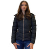 Woman wearing a black puffer jacket on a white background