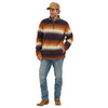 Man wearing a striped sweater, jeans, and a cap on a white background
